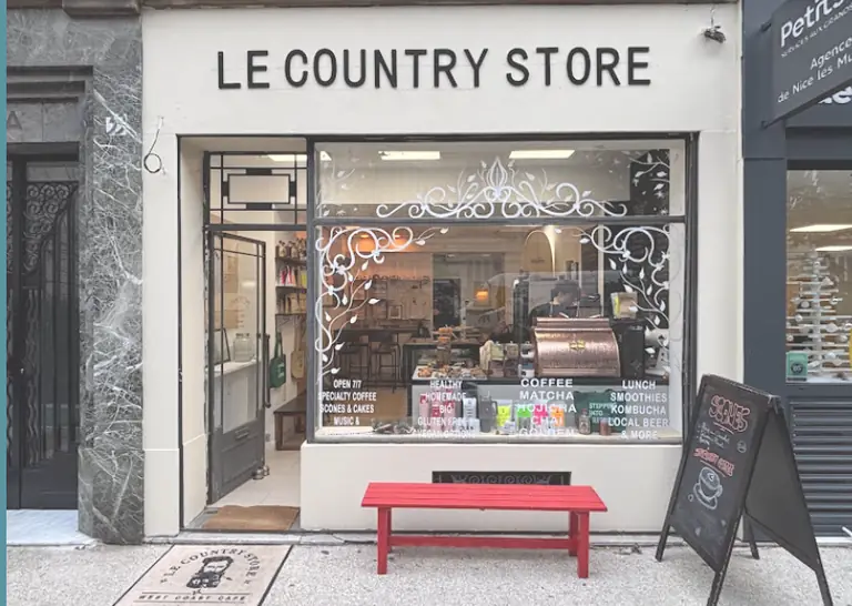 Le Country Store shopfront with red bench on a Nice street